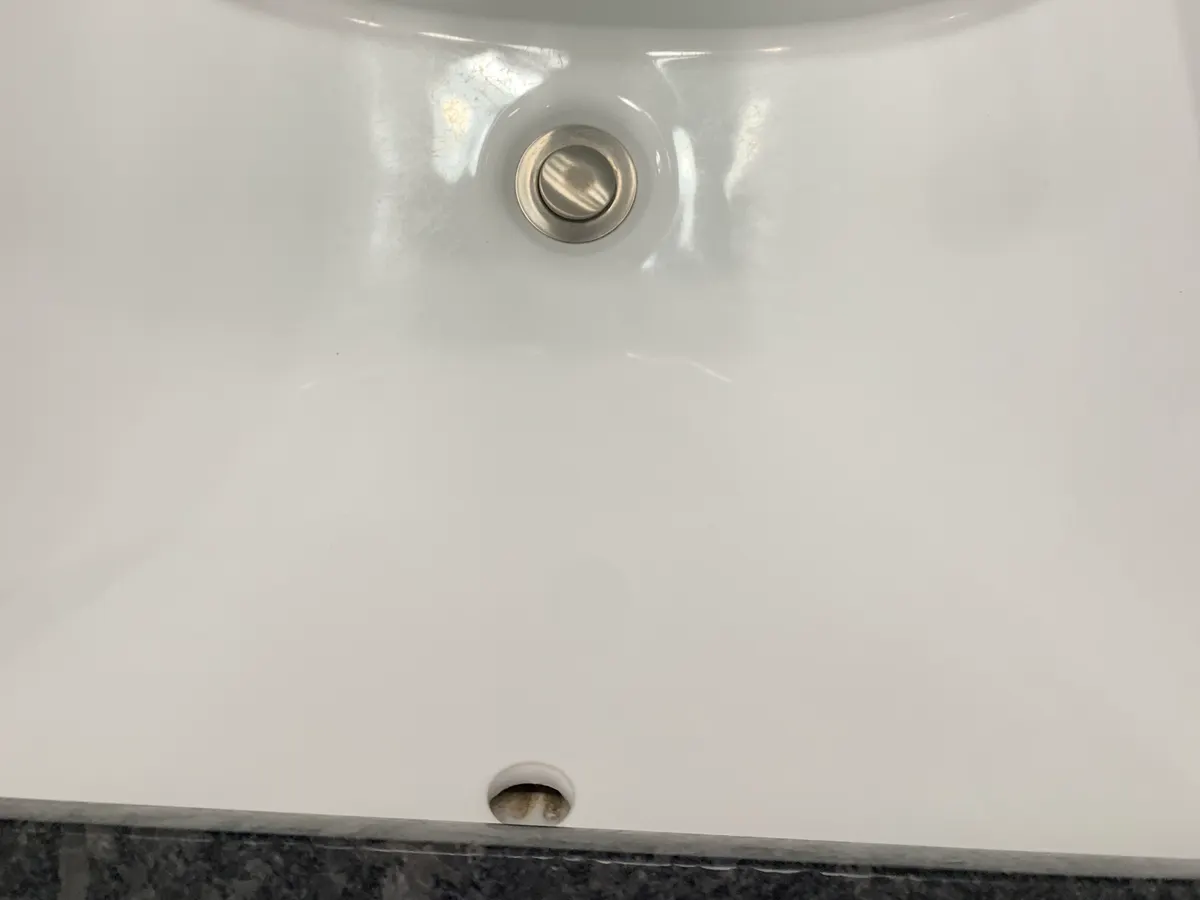 The same bathroom faucet after cleaning